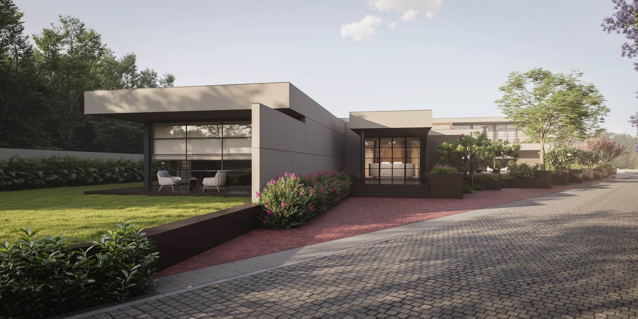 Landscaped entrance and waterbody at Anahata Villas